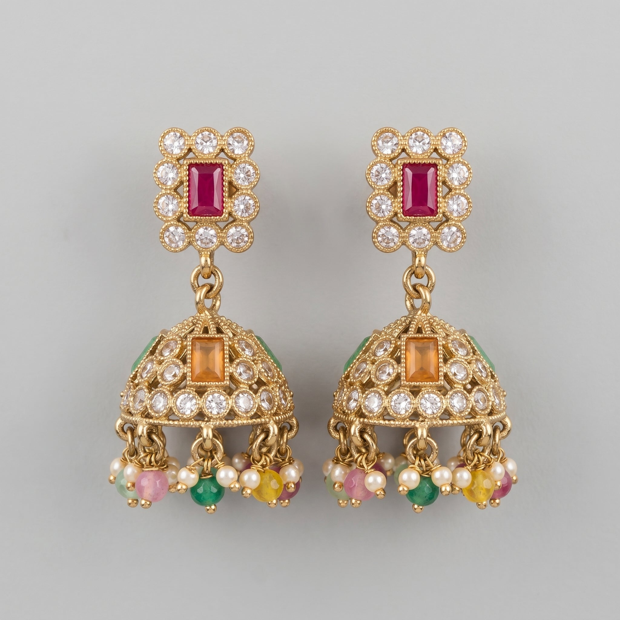 Kundan Earrings gold-tone multicolor kundan jhumka earrings with ruby stud on gray background