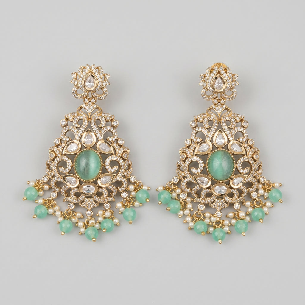Zara Mint Earrings gold-tone chandelier earrings with mint green cabochon and pearl fringe on gray background