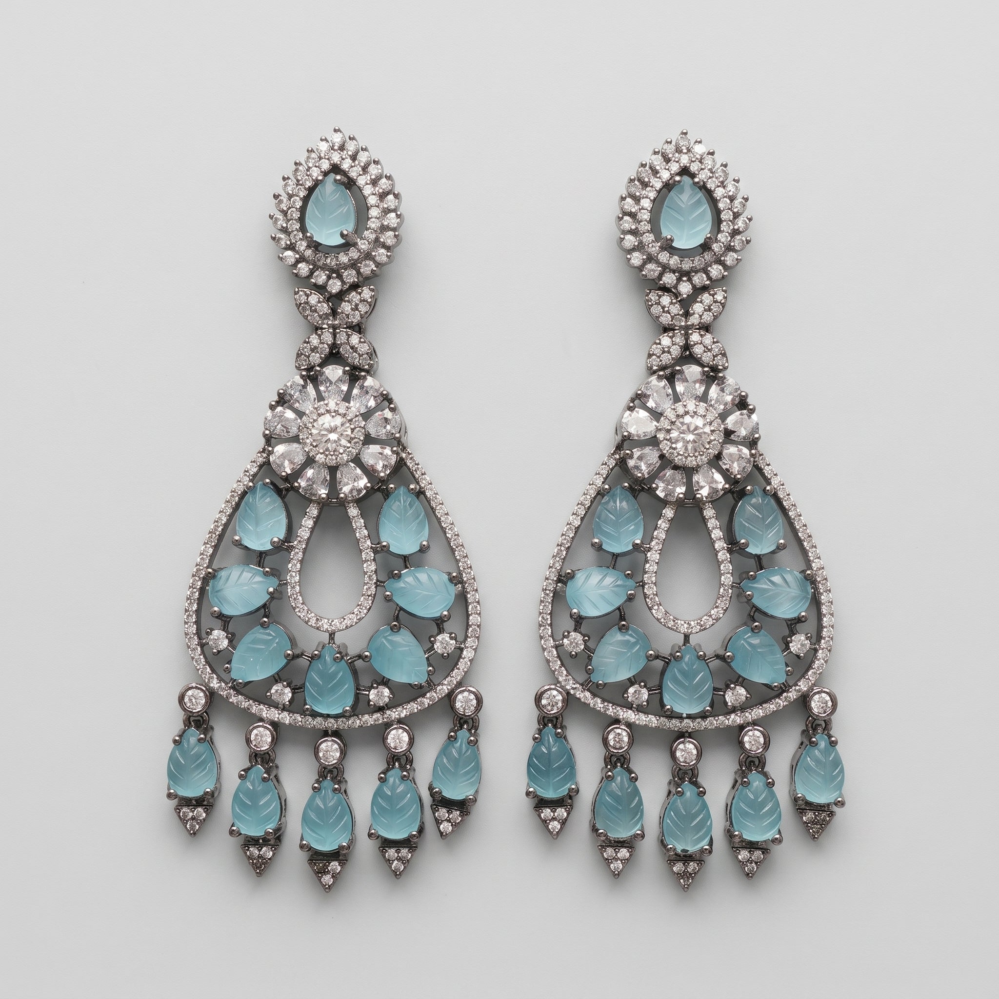 Aqua Leaf Earrings oxidized silver-tone chandelier drops with carved aqua leaf stones on gray background