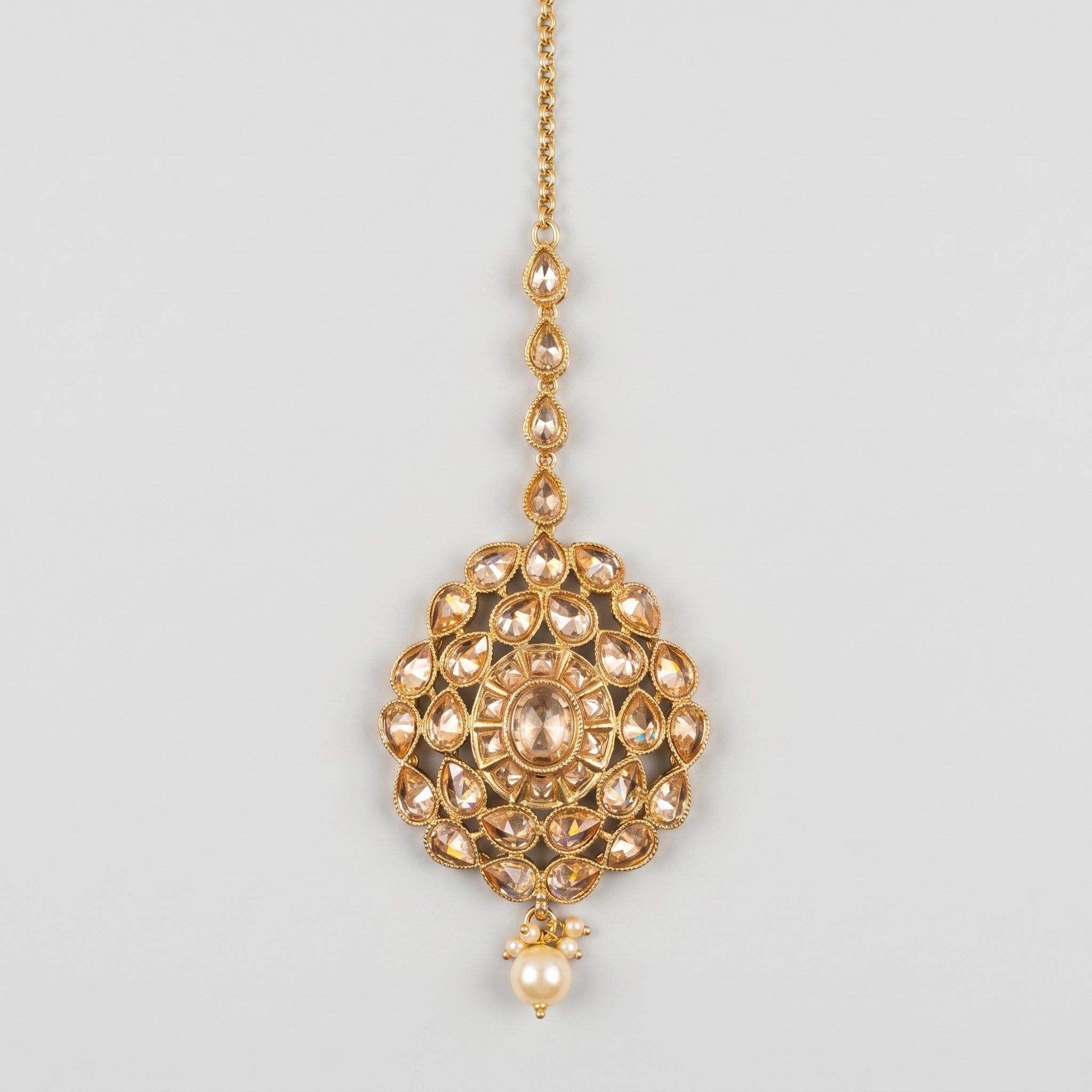 Polki Kundan Tikka gold-tone champagne stone maang tikka with pearl drop on gray background