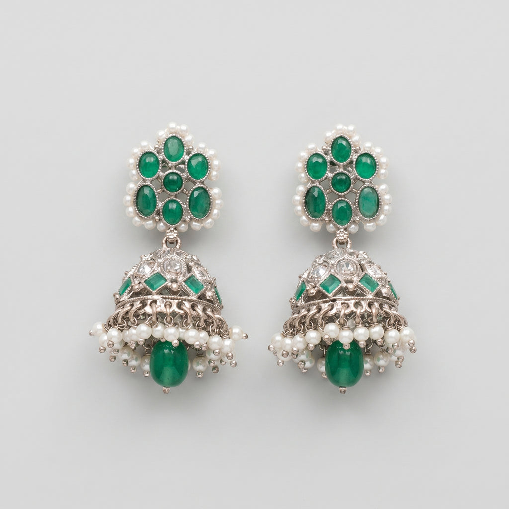 Rani Emerald Jhumka Earrings rhodium emerald jhumkas with pearl fringe on gray background