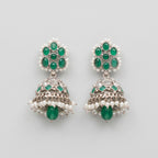 Rani Emerald Jhumka Earrings rhodium emerald jhumkas with pearl fringe on gray background