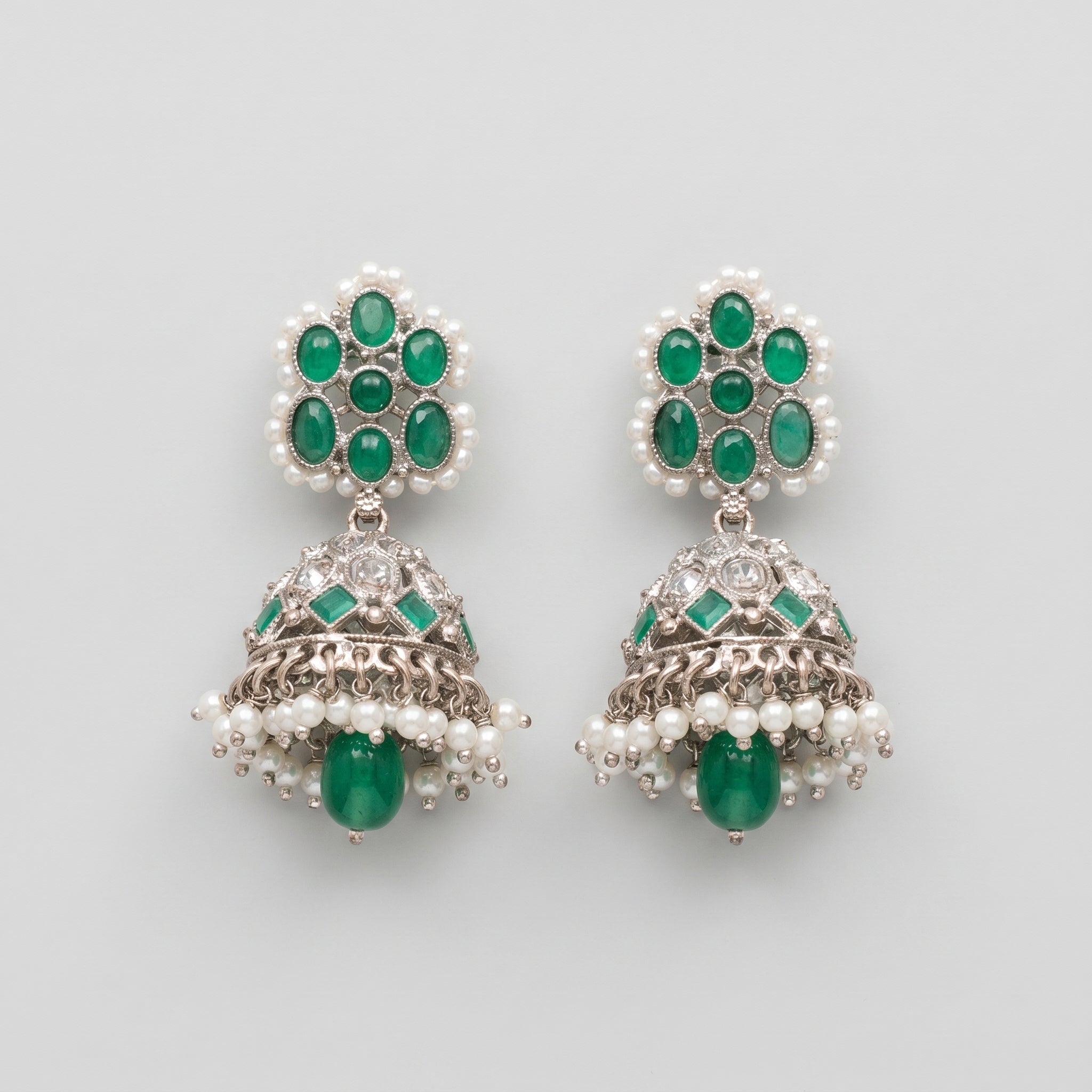 Rani Emerald Jhumka Earrings rhodium emerald jhumkas with pearl fringe on gray background