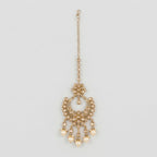 Kashi Pearl Tikka gold chandbali maang tikka with champagne stones and cream pearl drops on gray background