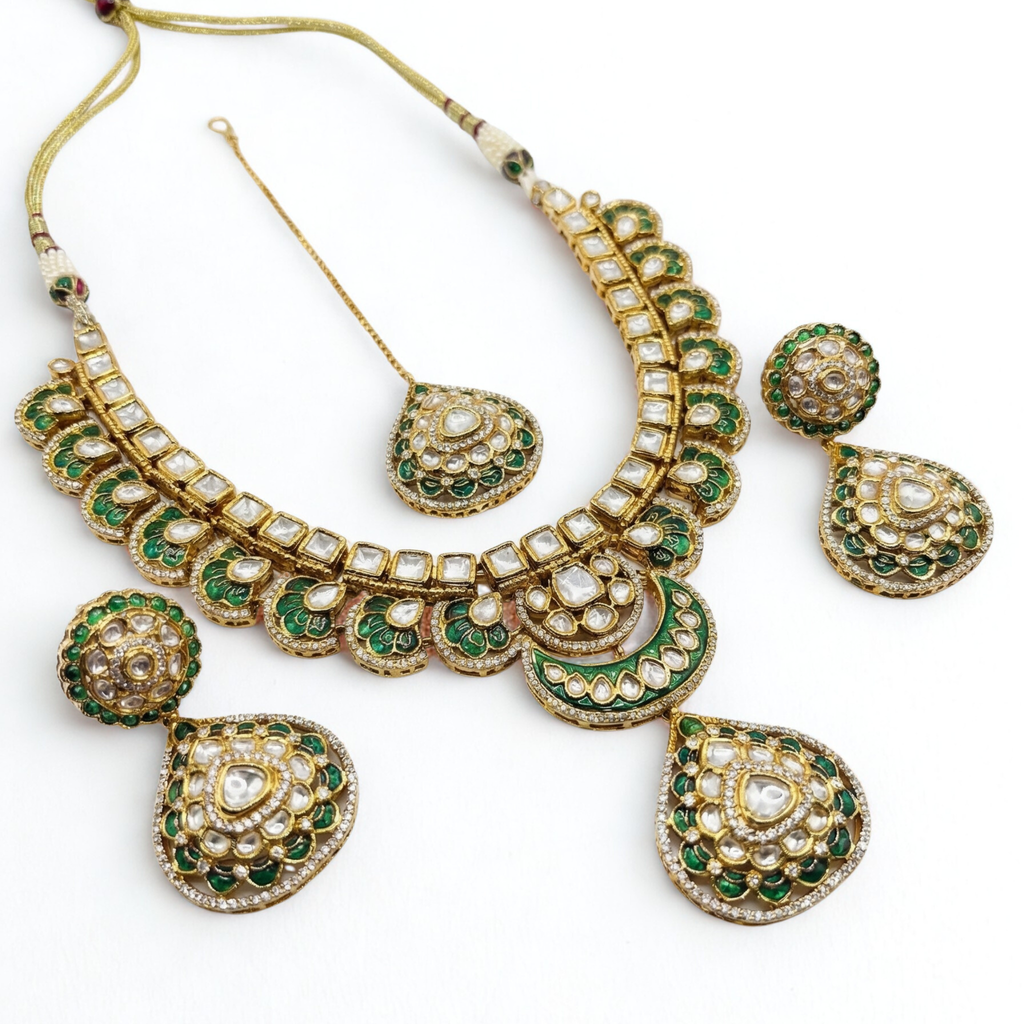 South Asian woman wearing Emerald Kundan Necklace Set necklace set with matching earrings — bridal look