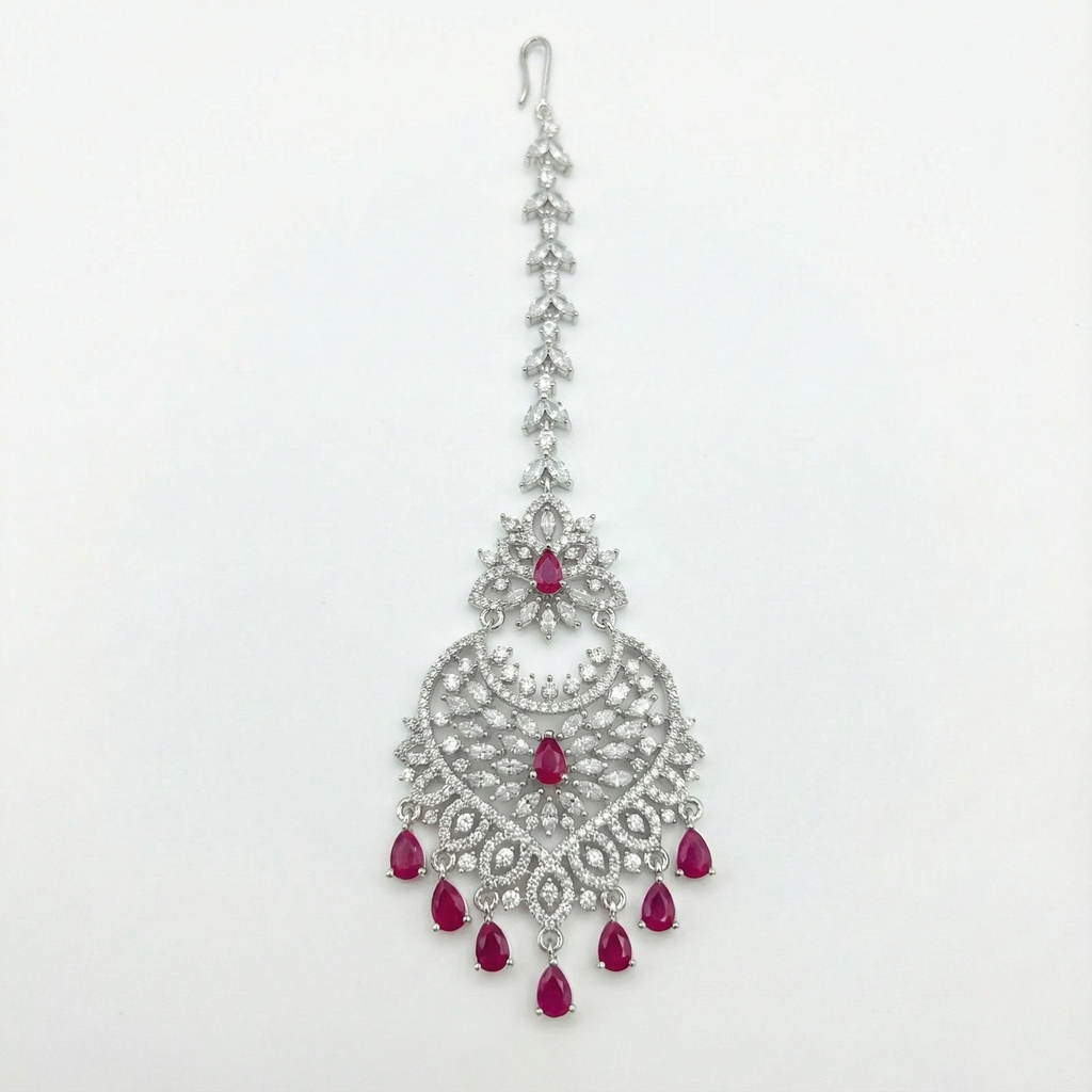 Moonfall Ruby Tikka silver-tone heart pendant maang tikka with red teardrop drops on gray background