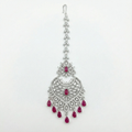 Moonfall Ruby Tikka silver-tone heart pendant maang tikka with red teardrop drops on gray background