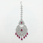 Moonfall Ruby Tikka silver-tone heart pendant maang tikka with red teardrop drops on gray background