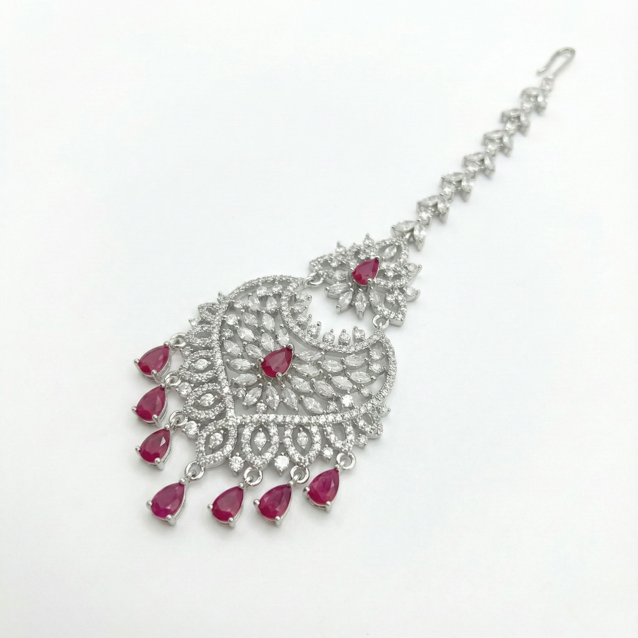 Moonfall Ruby Tikka detail of ruby-red center stones and seven bottom teardrop dangles