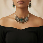 Studio flatlay of the silver-tone pearl choker with matching earrings