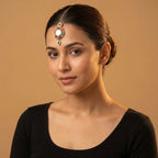 Rangoli Moti Tikka detail showing white center cabochon, colored stone ring, and green drop