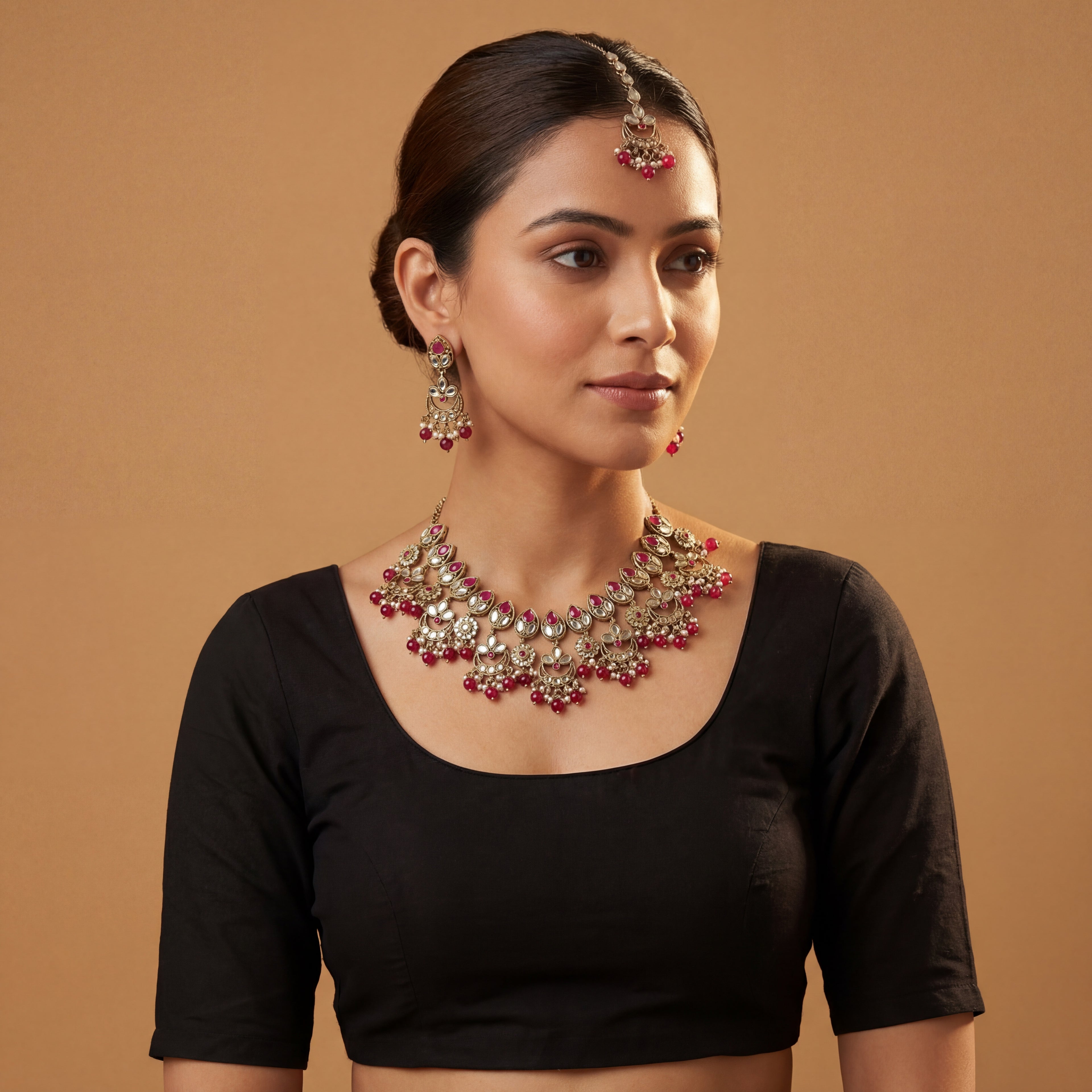 Rani Necklace Set detail showing pink teardrop stones, mirror-work, and pearl-and-bead fringe