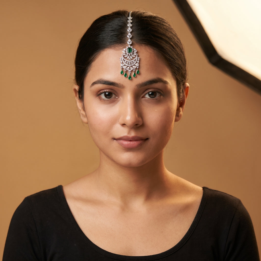 Sia Emerald Tikka detail showing emerald center stone and five green teardrop fringe drops