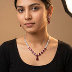 Rani Ruby Necklace Set detail of graduated ruby stones and clear teardrop accent border