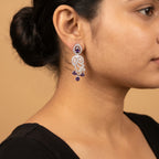 Pari Amethyst Earrings detail showing swirling filigree, marquise crystal leaves, and triple amethyst cluster