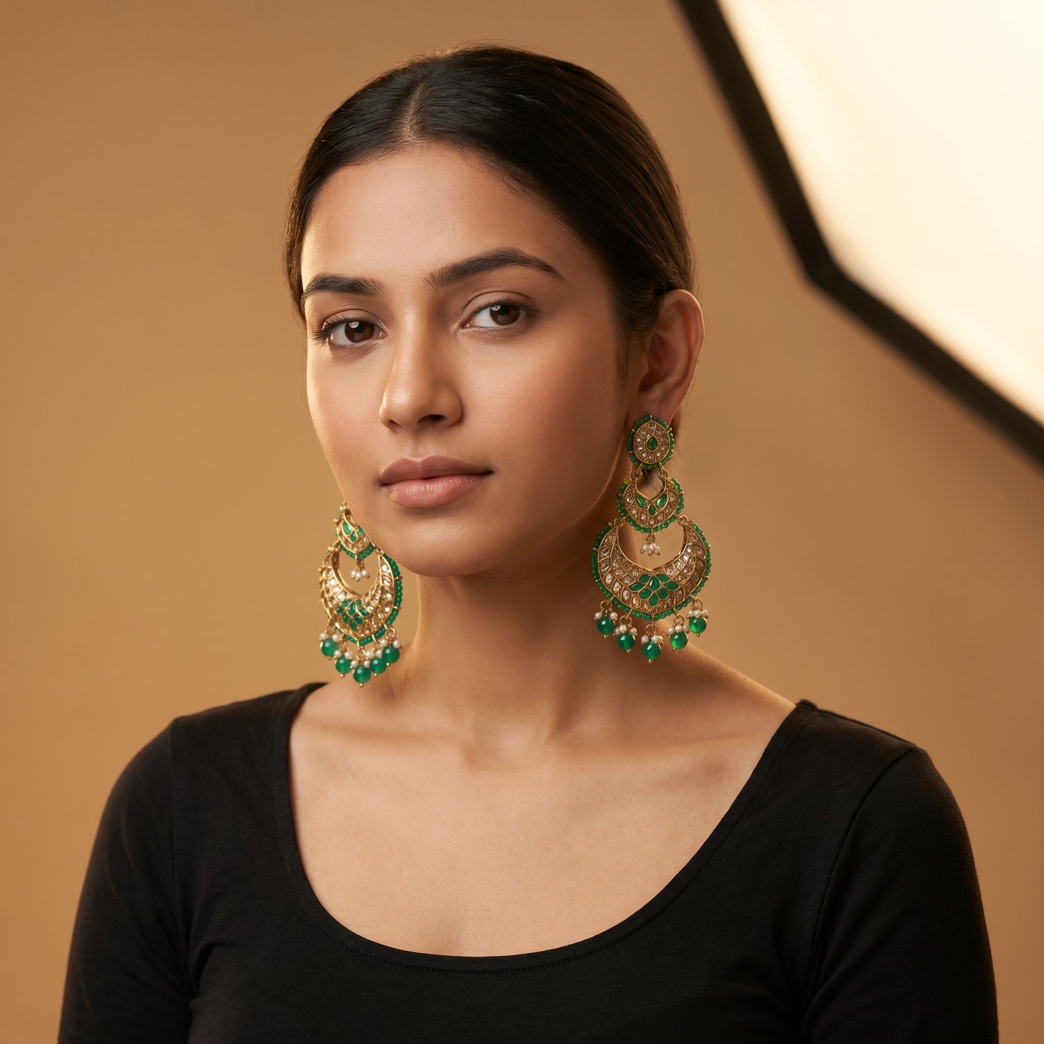 Jadau Panna Earrings detail showing tiered jali crescent, emerald teardrops, and pearl dangles