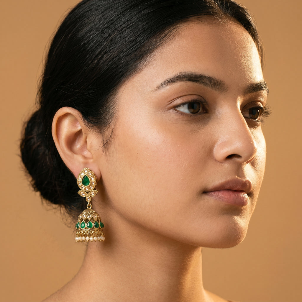 Panna Jhumka Earrings detail showing emerald-green teardrop stud, granulated bell dome, and seed-pearl ghungroo fringe