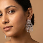 Chand Dazzle Earrings detail showing pavé crescent and dangling pears
