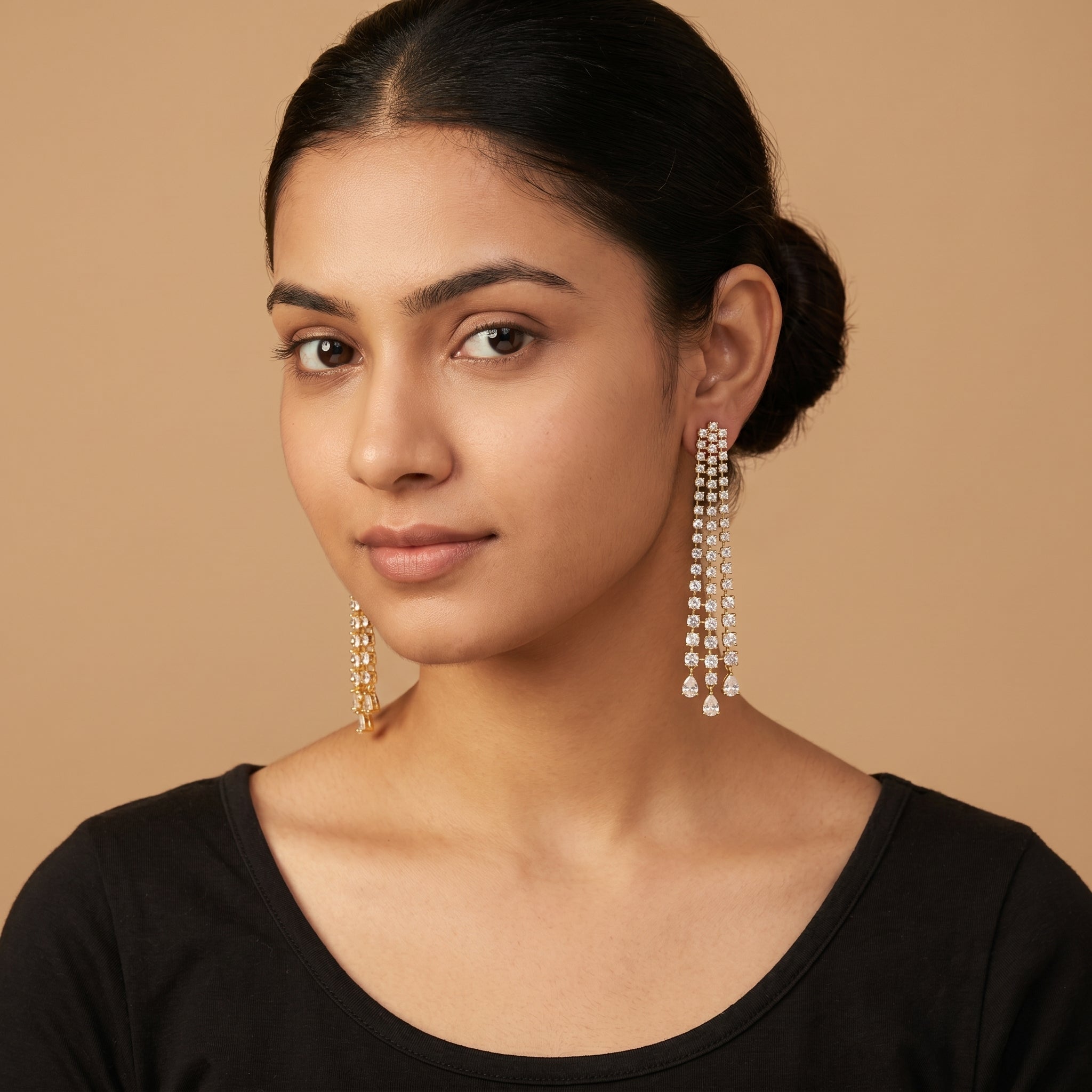 Hira Stream Earrings detail showing four-strand crystal grid panel and pear-cut teardrop dangle fringe