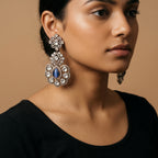 Neelam Bloom Earrings detail showing midnight blue cat's eye center, rose-cut crystal petals, and floral pavé halo