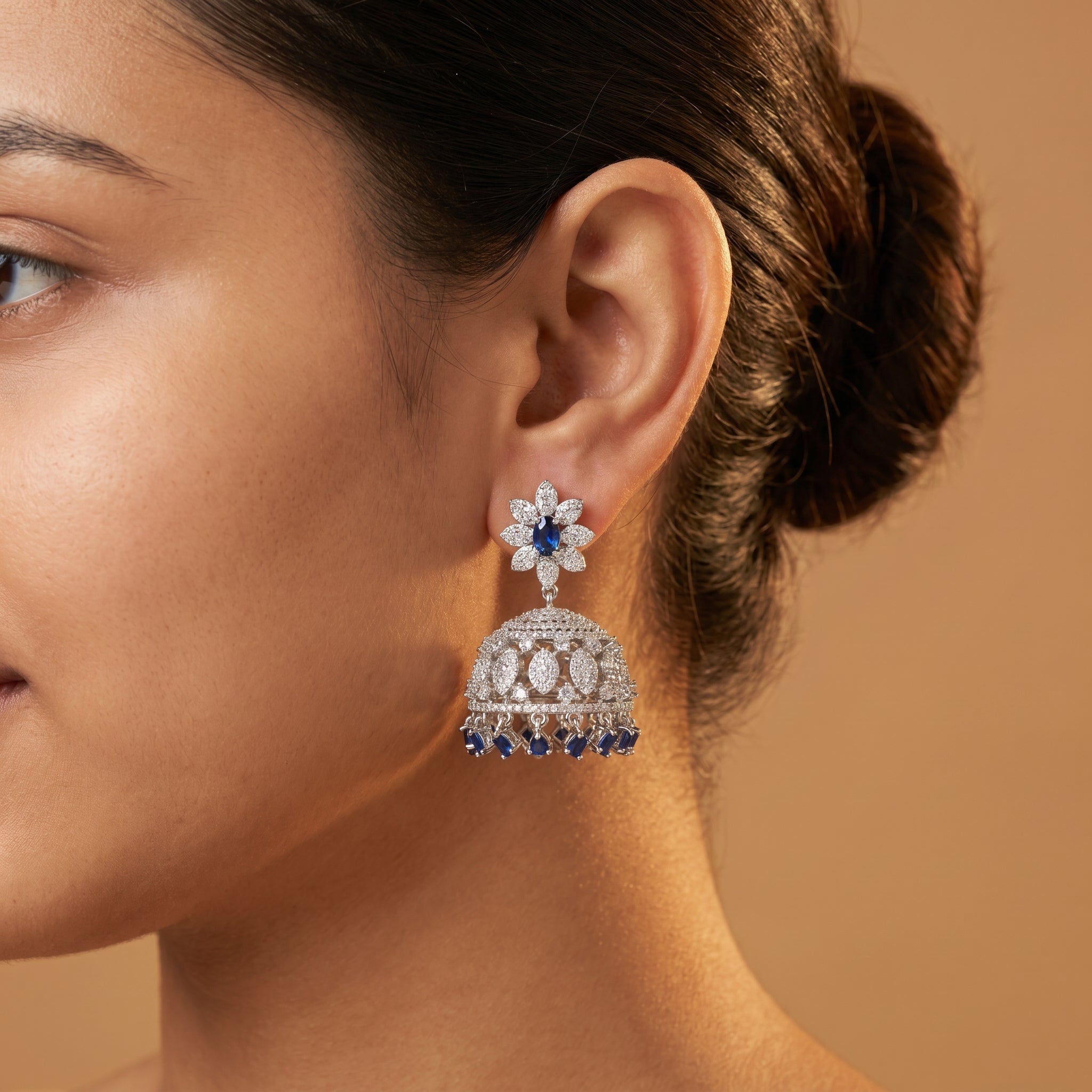 Neelam Jhumka Earrings detail showing floral blue stud and domed bell