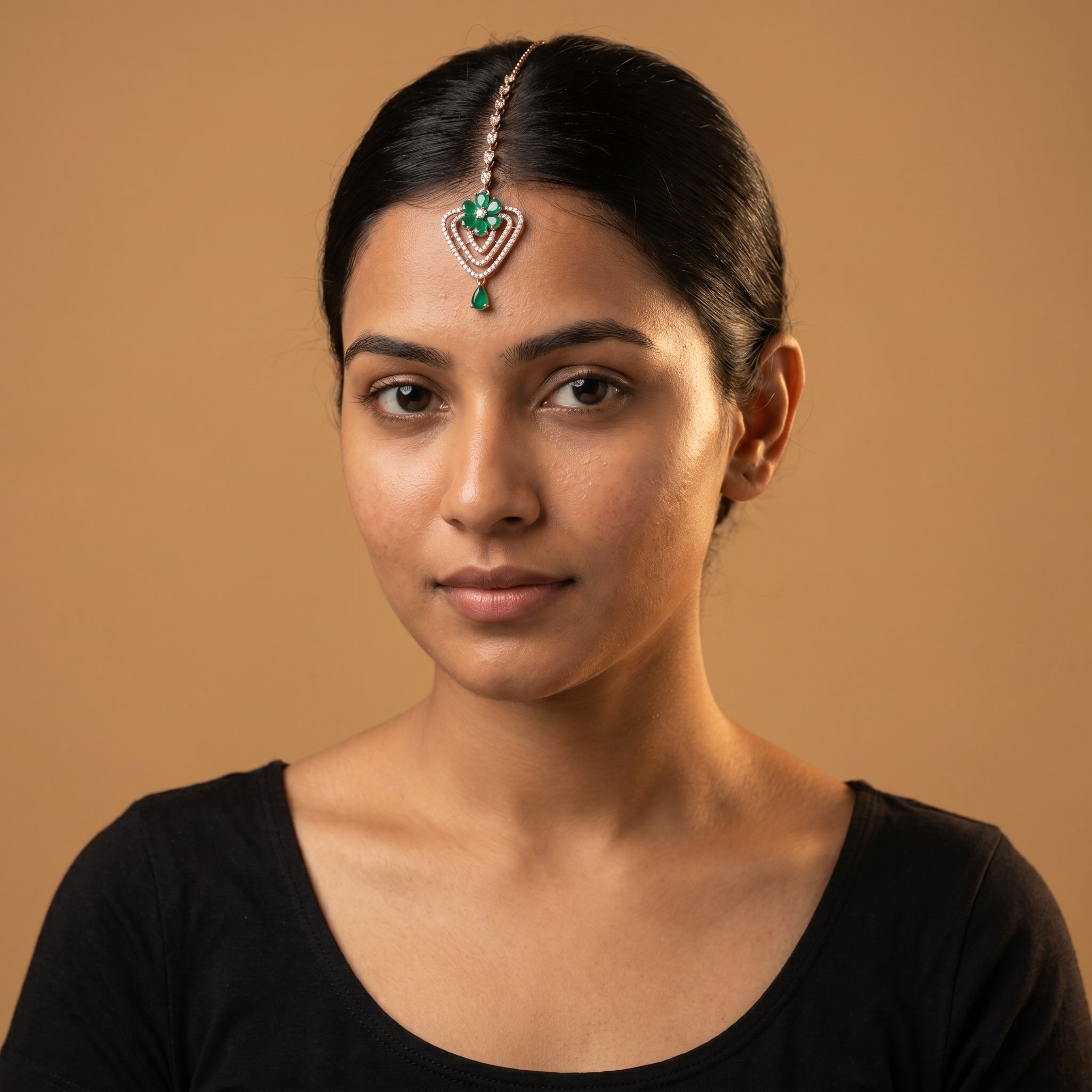 Pushpa Emerald Tikka detail showing teardrop chain emerald petals and pear drop