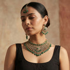 Majestic Emerald Choker Set detail showing emerald teardrop fringe and polki filigree