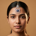 Adah Sapphire Tikka detail showing filigree round frame, blue stone flower, and crystal fringe