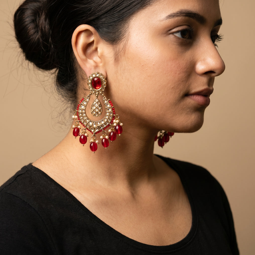 Jadau Ruby Earrings detail showing red oval stud kundan grid crescent and red bead pearl drops