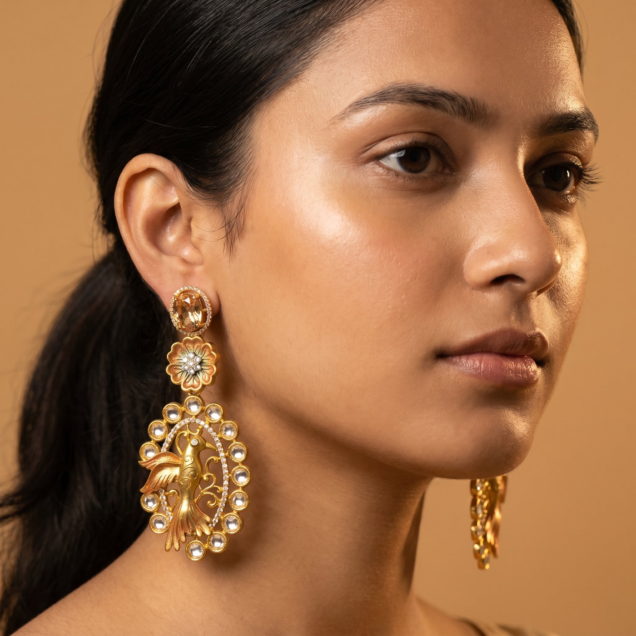 Hansini Drop Earrings detail showing champagne oval stud floral link and filigree bird oval drop
