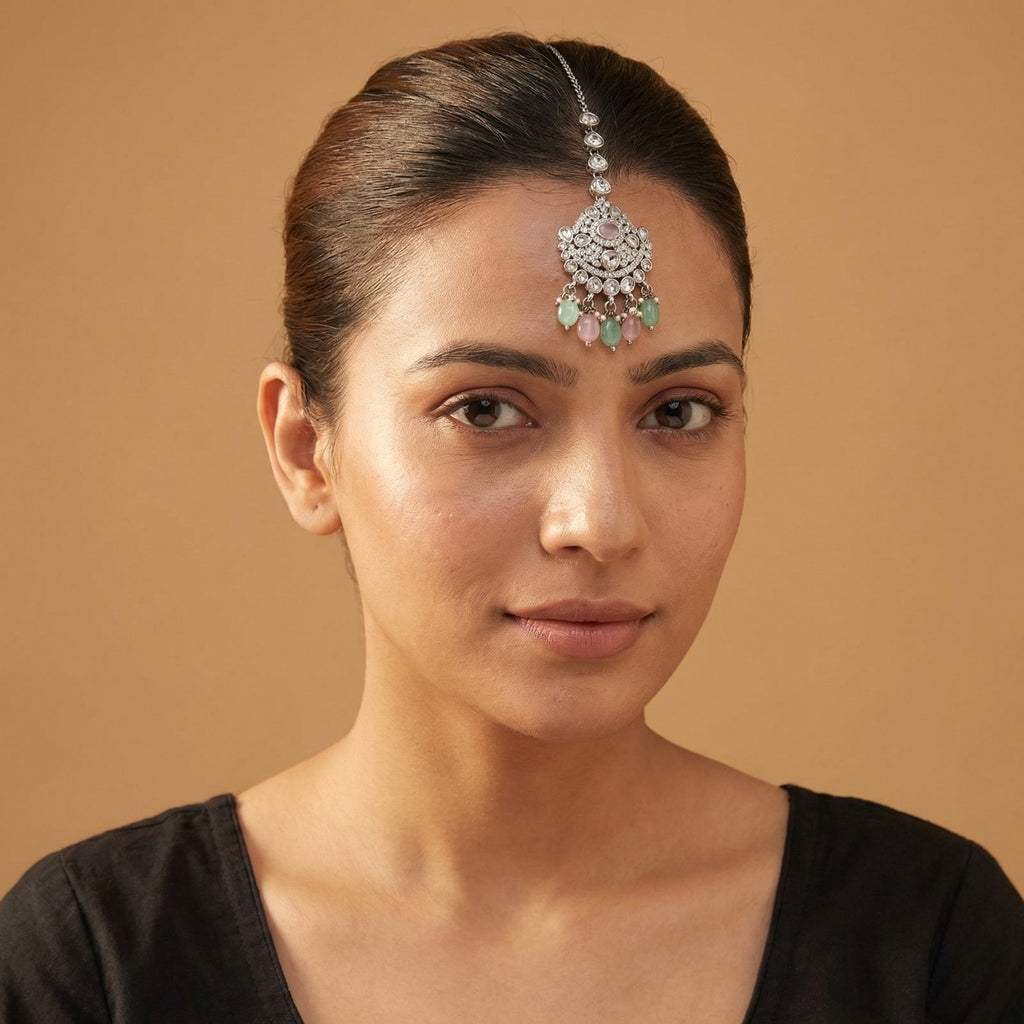 Mridul Tikka detail showing pavé pendant, pink oval stone, and alternating green pink bead drops