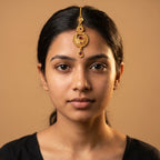 Padma Crimson Tikka detail showing granulated circular pendant and crimson teardrop dangle