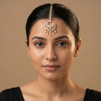 Amala Zircon Tikka detail showing emerald-cut connector, pavé medallion, and five pear crystal dangles