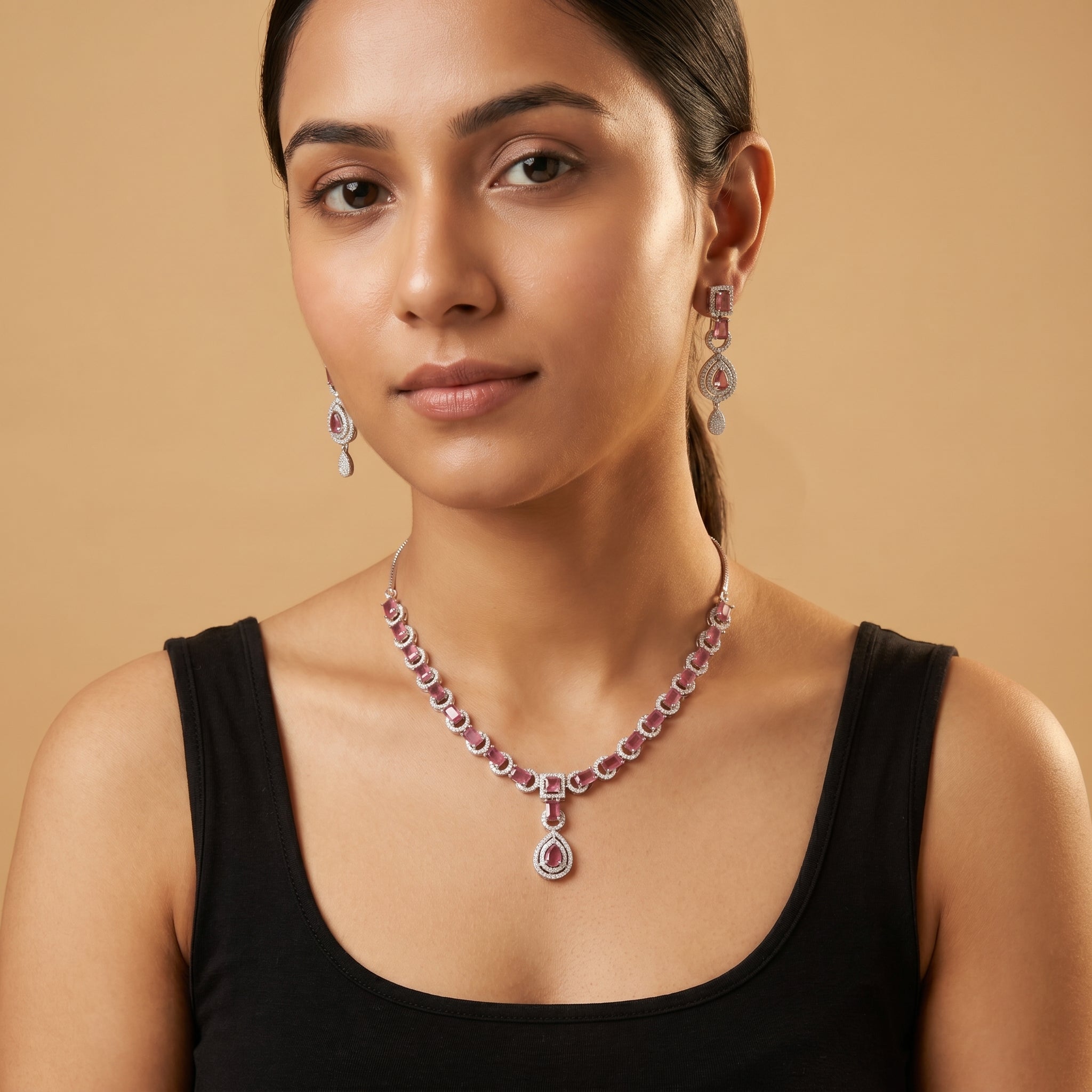 Rani Ruby Necklace Set detail of ruby pear drop pendant and crystal halo setting