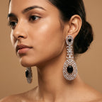 Zara Onyx Earrings detail showing oval black onyx stones, marquise crystal floral link, and pavé lace filigree