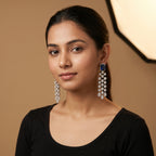Neelam Drop Earrings detail showing triple cascading crystal columns