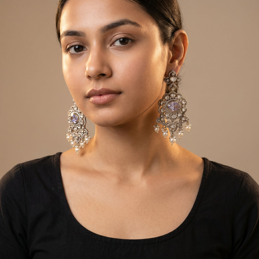 Rani Pearl Earrings detail showing lavender-purple oval center, polki crystal halo, and cream pearl dangles