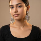 Rani Pearl Earrings detail showing lavender-purple oval center, polki crystal halo, and cream pearl dangles