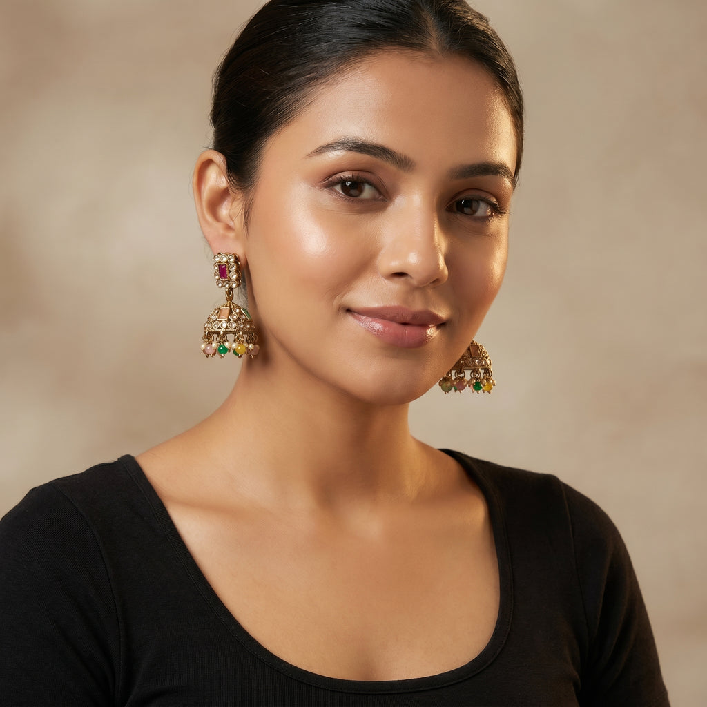 Kundan Earrings detail showing ruby rectangular stud orange and green dome stones and colored bead latkan