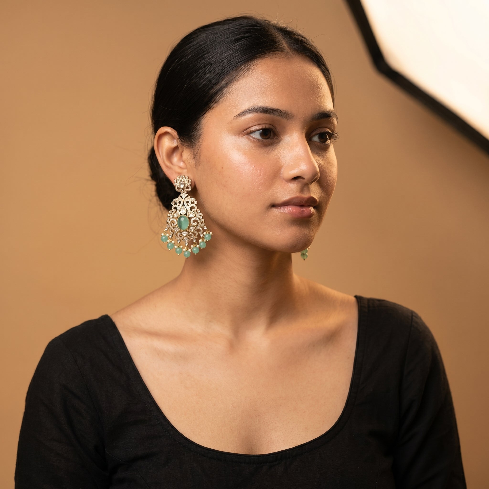 Zara Mint Earrings detail showing milky mint-green center stone, pavé filigree frame, and green bead pearl dangles