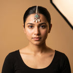 Firozi Pearl Tikka detail showing carved green floral pendant with pink teardrop stones and pearl dangles