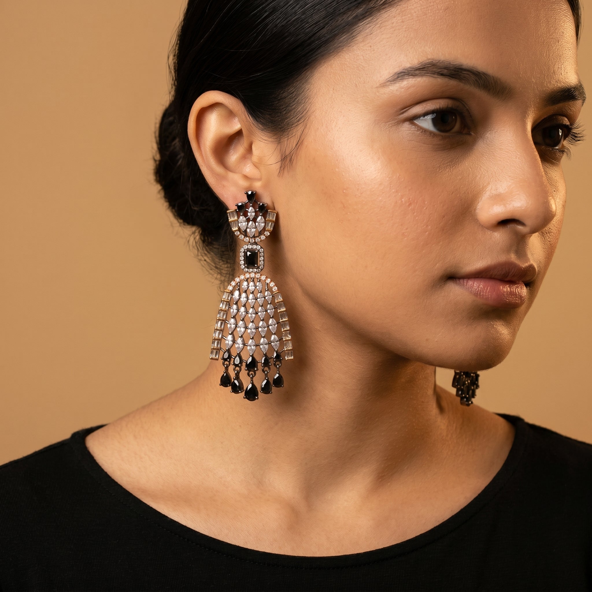 Kala Jhalar Earrings detail showing marquise lattice arch rose gold baguette border and black pear dangles