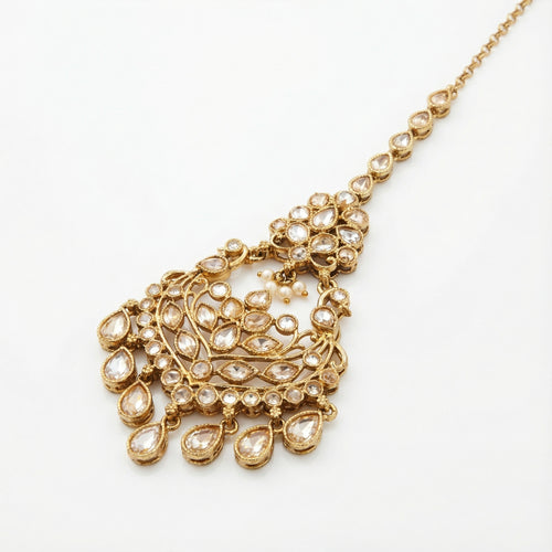 Antique Golden Tikka detail showing filigree pendant, pearl cluster accent, and crystal drop fringe
