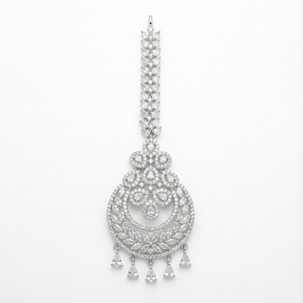 Crystal Crest Tikka silver-tone circular maang tikka with clear stones and five pear drops on gray background