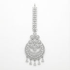 Crystal Crest Tikka silver-tone circular maang tikka with clear stones and five pear drops on gray background