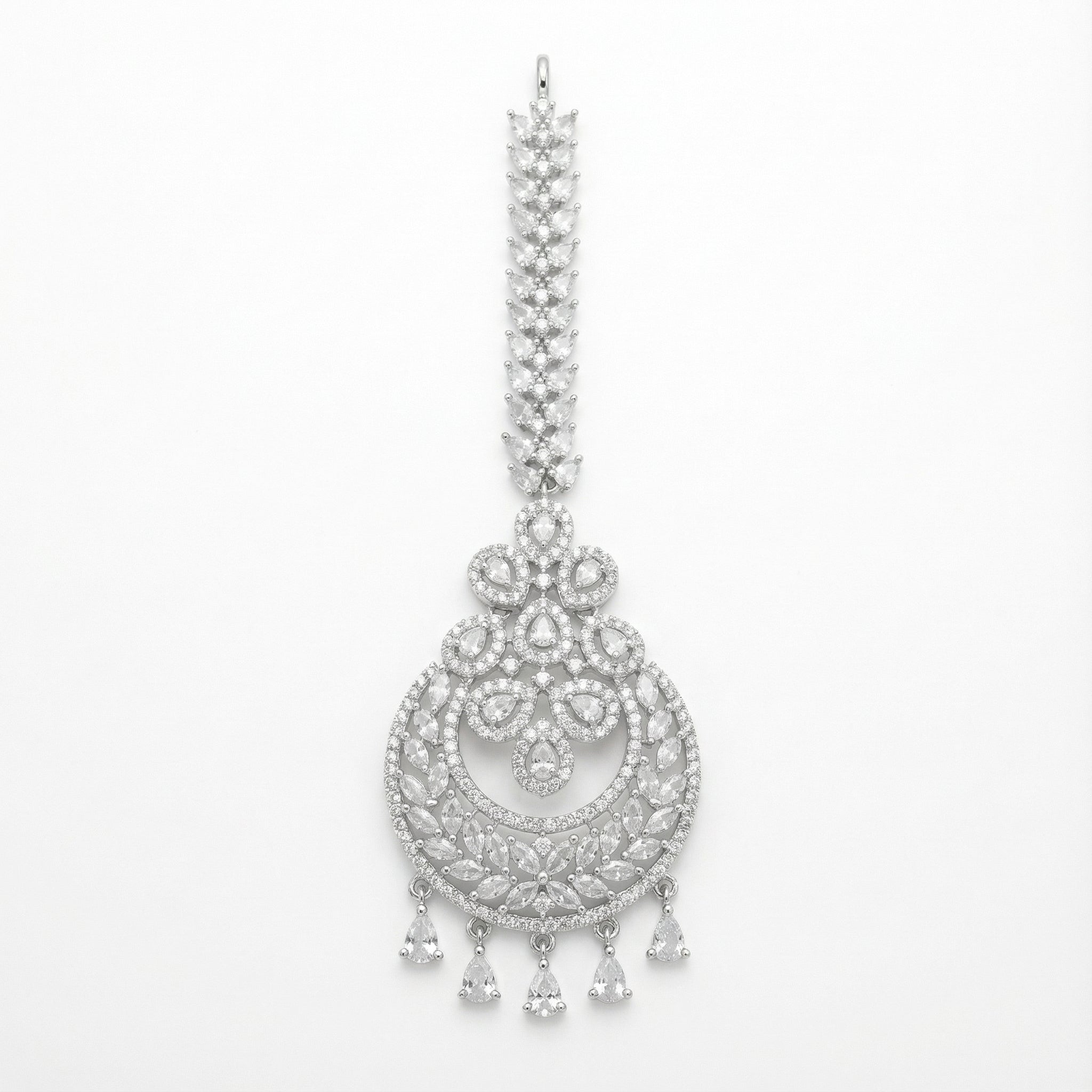 Crystal Crest Tikka silver-tone circular maang tikka with clear stones and five pear drops on gray background