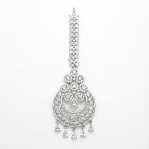 Crystal Crest Tikka silver-tone circular maang tikka with clear stones and five pear drops on gray background
