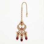 Chandrika Ruby Drop Tikka gold-tone kundan maang tikka with ruby drops and pearls on gray background