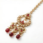 Chandrika Ruby Drop Tikka detail of circular clear frame with ruby accents and three bottom bead drops