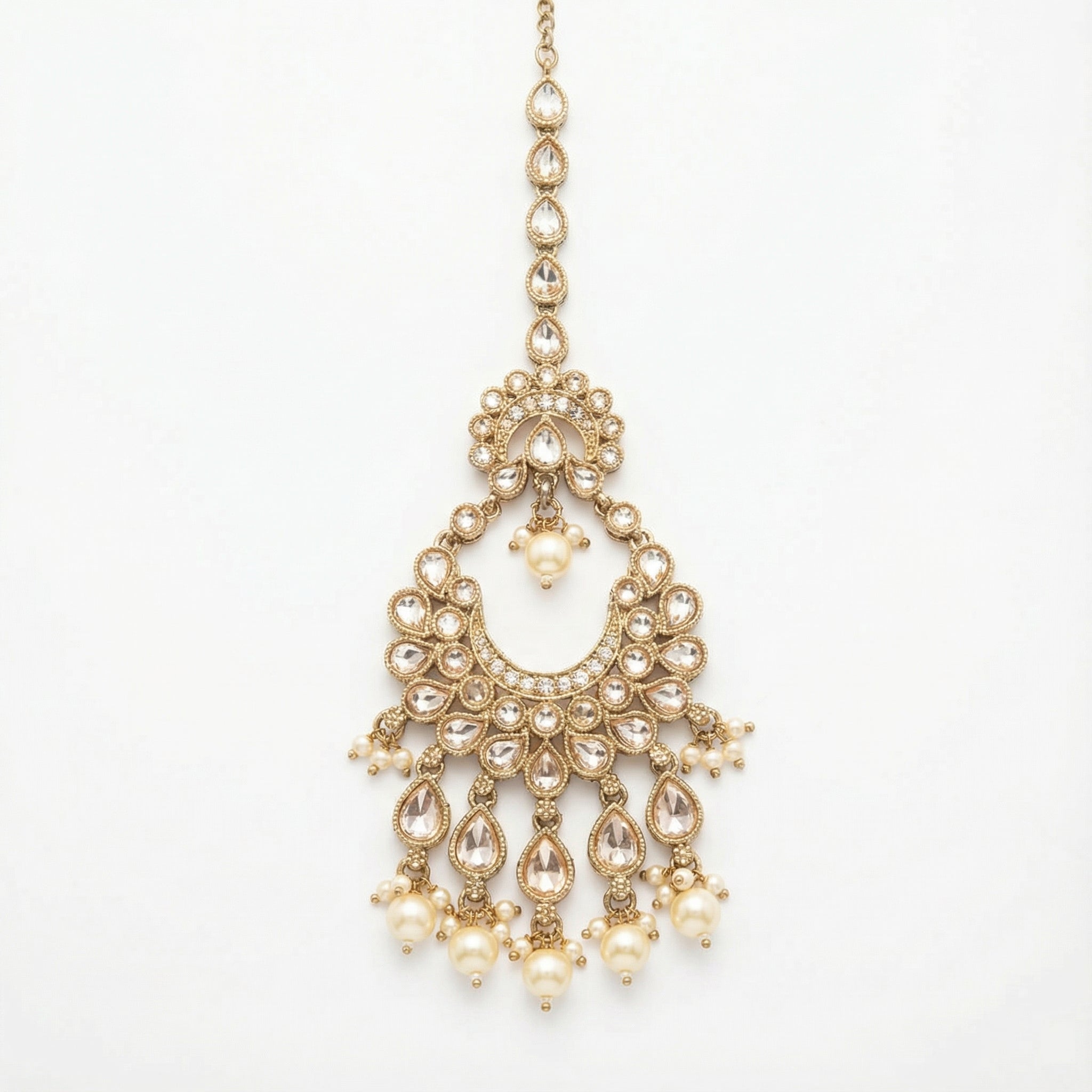 Ivory Heirloom Crescent Tikka gold chandbali maang tikka with clear crystals and pearl drops on gray background